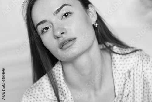 brunette woman in pajamas. black and white