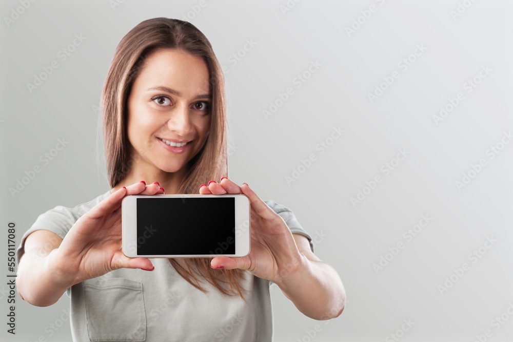 Smiling young person hold Mobile Phone