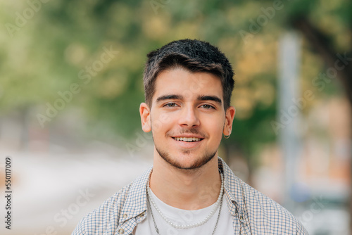 portrait of young man with beard outdoors
