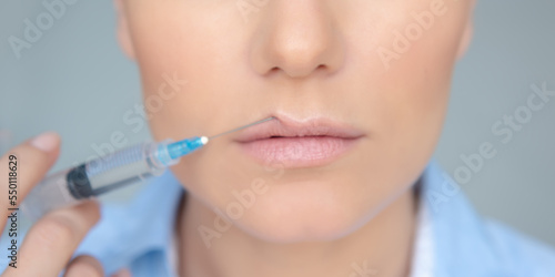 Woman Making a Lip Augmentation