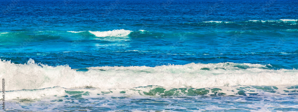 Blue sea wave with white foam. Ocean sea wave