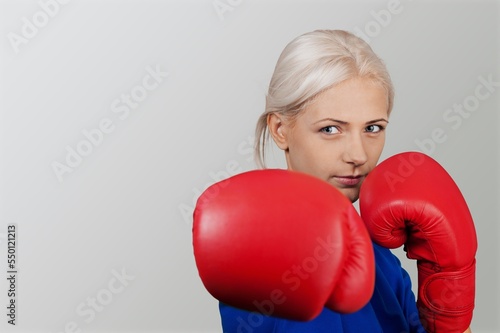 Sporty young woman in boxing gloves © BillionPhotos.com