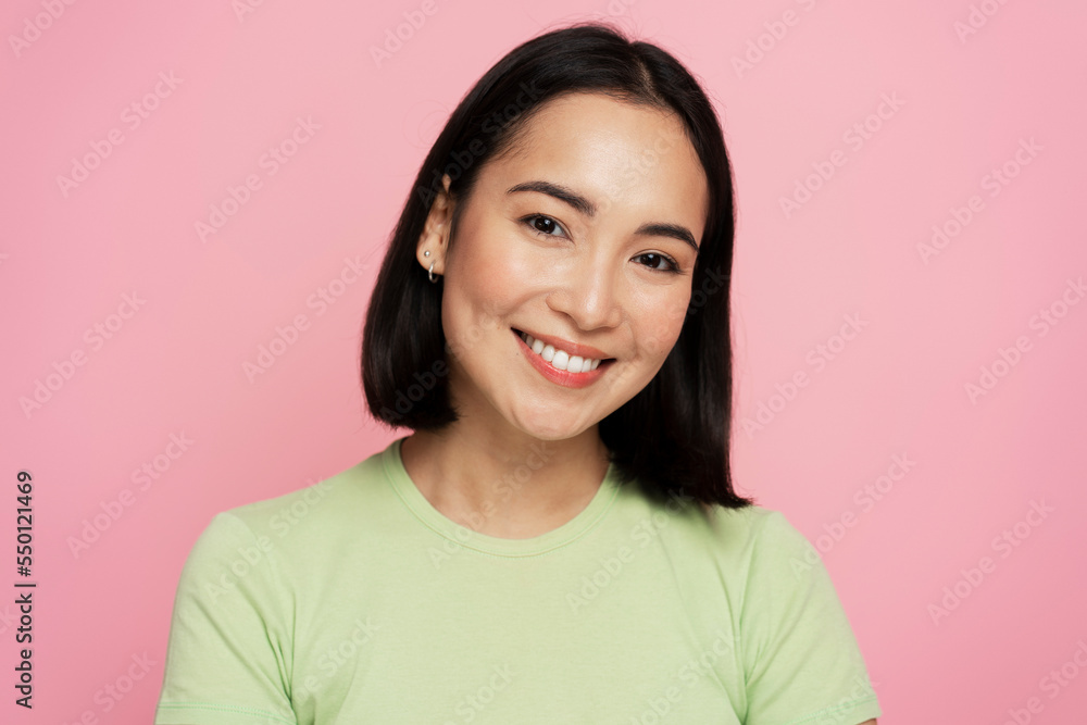 Portrait of happy successful asian woman standing, looking at camera with charming smile Portrait of happy successful asian woman standing, looking at camera with charming smile