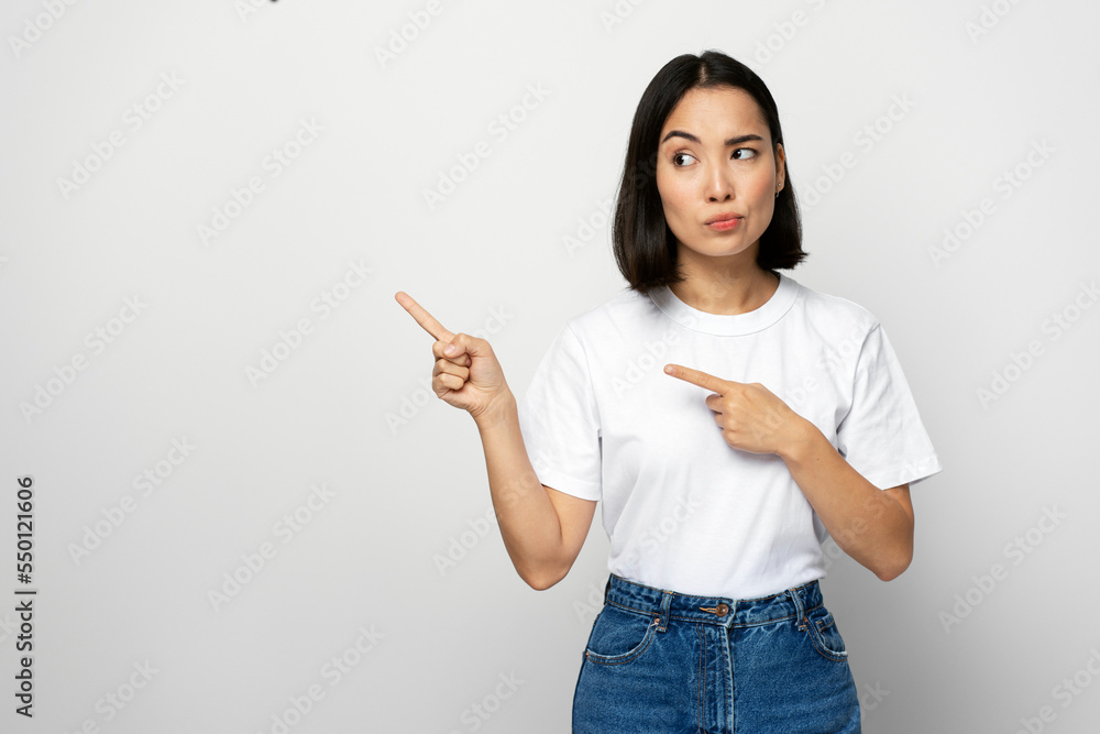 Serious confident bossy woman pointing fingers, making choice, thinking Serious confident bossy woman pointing fingers, making choice, thinking