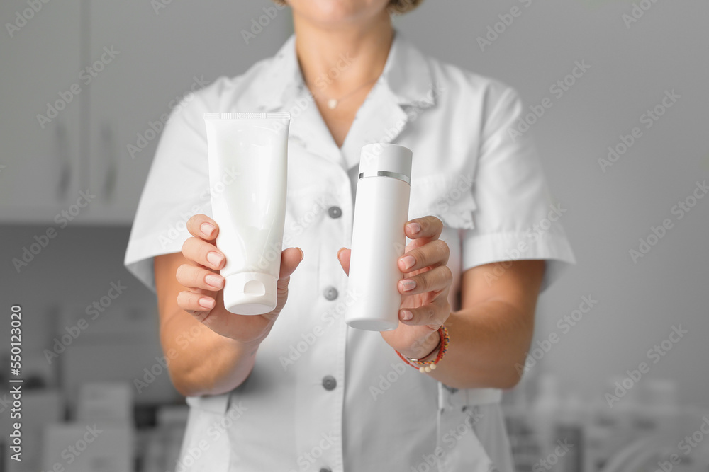 Jars of cream in two hands of a girl close-up Jars of cream in two hands of a girl close-up