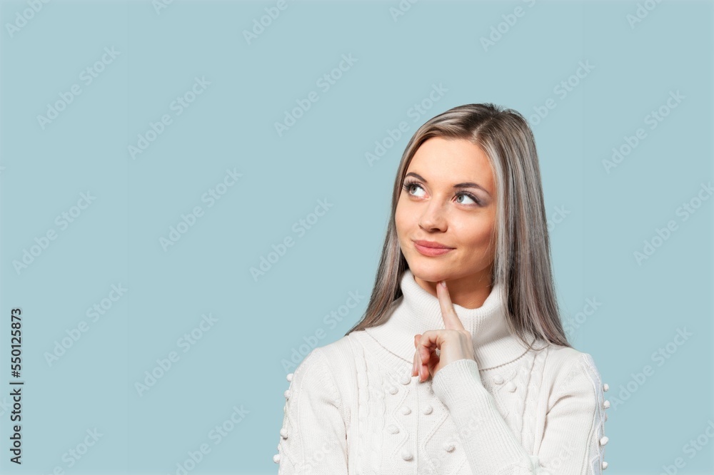 Happy young girl pointing finger on color background Happy young girl pointing finger on color background