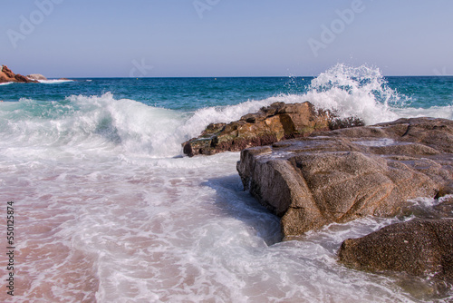 Huge waves crash against the rocks at Fenals Beach in Lloret de Mar. Catalonia photo