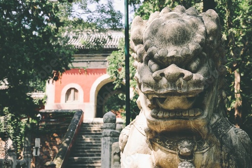 Stairs to the red old building of Biyun Temple decorated with sculpture of lion, Beijing,China photo