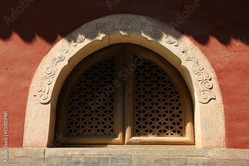 Window with patterns of the red old building of Biyun Temple, Beijing,China photo