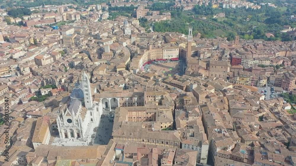 Aerial view of Duomo di Siena, Romanesque gothic cathedral.Tuscany, Italy. Siena Cathedral is a cathedral consecrated in honor of the Assumption of the Blessed Virgin Mary. Aerial view of Duomo di Siena, Romanesque gothic cathedral.Tuscany, Italy. Siena Cathedral is a cathedral consecrated in honor of the Assumption of the Blessed Virgin Mary.