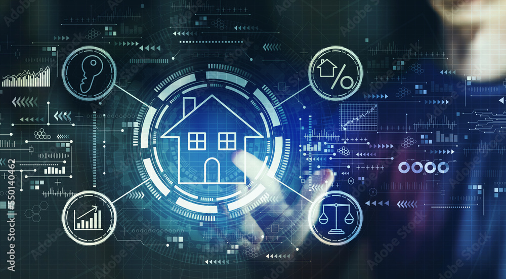 Real estate theme with young man touching a digital screen at night Real estate theme with young man touching a digital screen at night