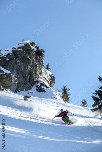 Marmaros, The Carpathians, UKRAINE - March 11 2021: A skier on Black Crows skis descends a steep descent