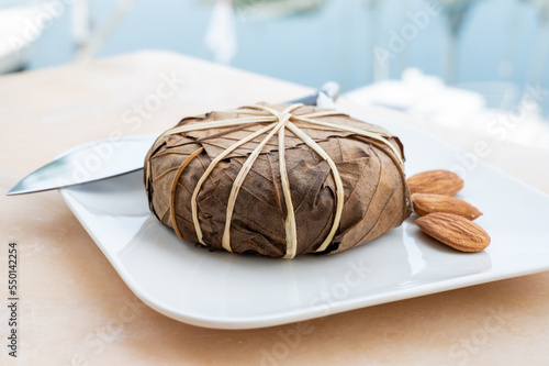 French mountains cheese banon wrapped in chestnut leaves made in Provence from unpasteurised goat milk photo