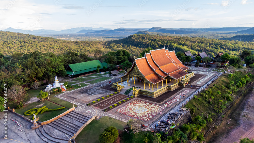 Top view Aerial photo from flying drone. Amazing Sirindhorn Wararam(Wat Phu Prao), tree shaped fluorescence art temple, Sirindhorn District, Ubon Ratchathani, Thailand. Photo by select focus. Top view Aerial photo from flying drone. Amazing Sirindhorn Wararam(Wat Phu Prao), tree shaped fluorescence art temple, Sirindhorn District, Ubon Ratchathani, Thailand. Photo by select focus.