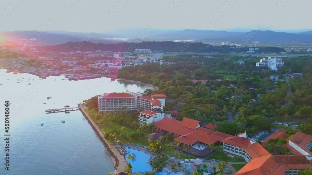 Video Stock Sunset aerial view of Kampung Tanjung Aru with hotels and