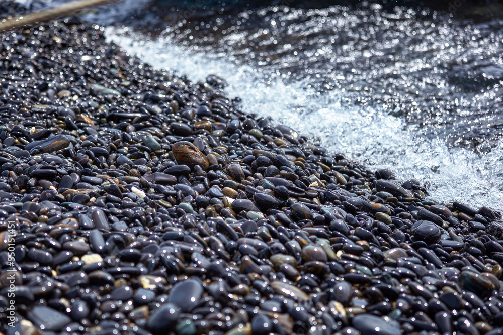 Pebbles on the beach with sea wave Pebbles on the beach with sea wave