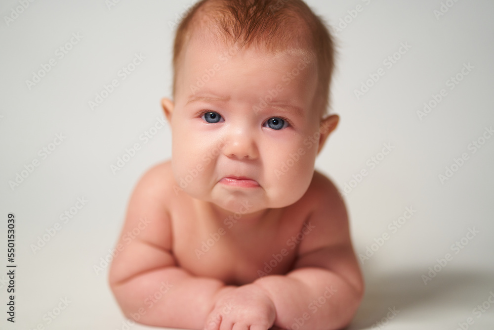 portrait of a baby with a sad emotion portrait of a baby with a sad emotion