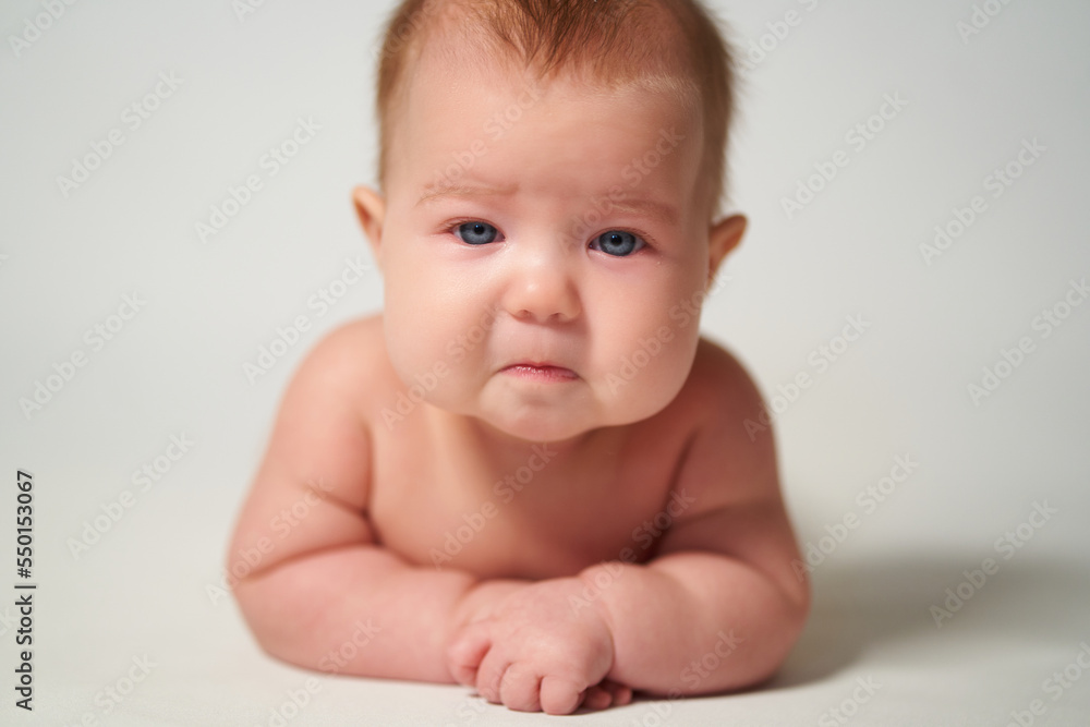 portrait of a baby with a sad emotion portrait of a baby with a sad emotion