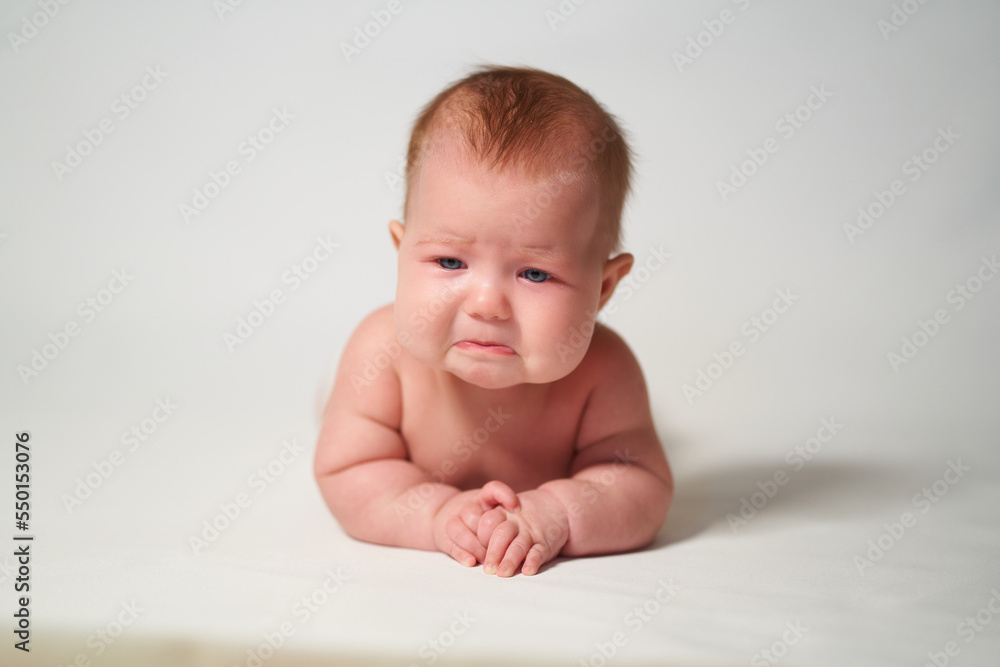 portrait of a baby with a sad emotion portrait of a baby with a sad emotion