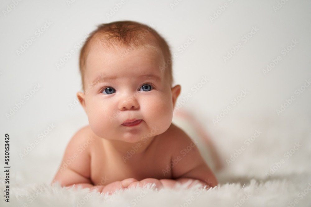 portrait of an infant with the emotion of a thinking person on a white background portrait of an infant with the emotion of a thinking person on a white background