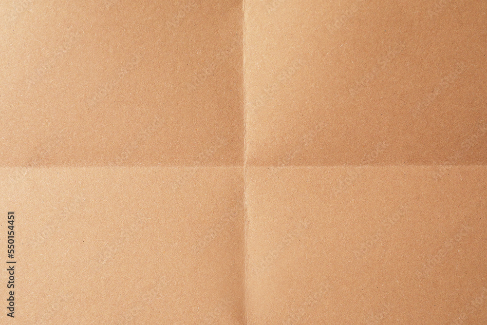 Fototapeta premium Folded kraft paper sheet as background, top view