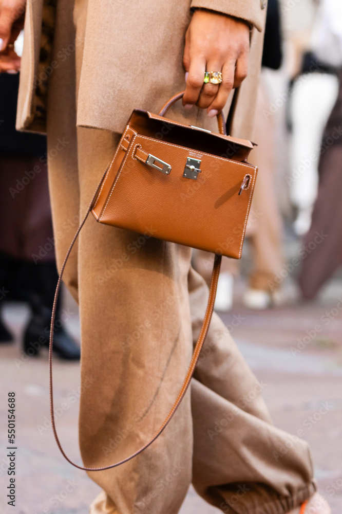 Milan, Italy - September, 22, 2022: woman influencer wearing Kelly Sellier  bag from Hermes. Fashion blogger outfit details, street style Stock Photo