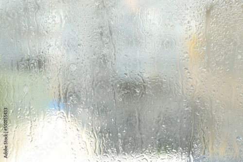 Window glass with raindrops as background, closeup