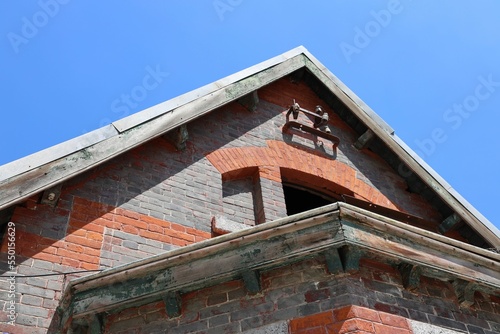 Closeup of a brick paved roof with a little window of the ancient Beijing Erqi factory, China photo