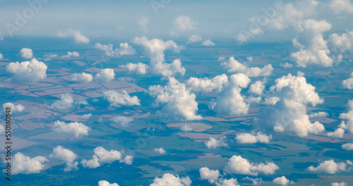View of the clouds flying in the sky from the window of an airplane.