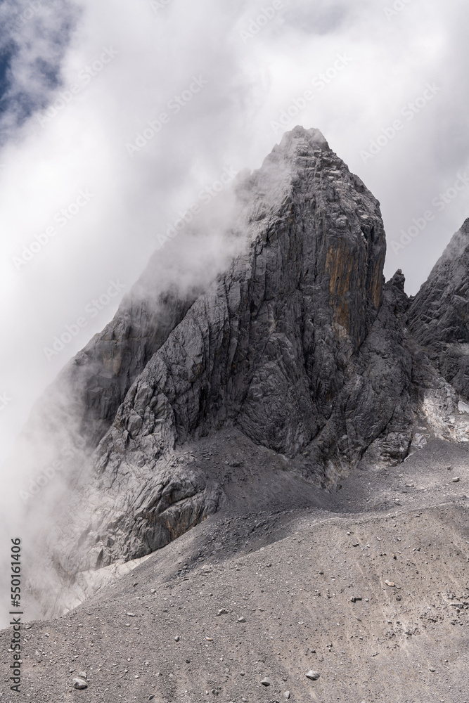 Glimpse of the highest peak of Jade Dragon Snow Mountain on Foggy Morning Glimpse of the highest peak of Jade Dragon Snow Mountain on Foggy Morning