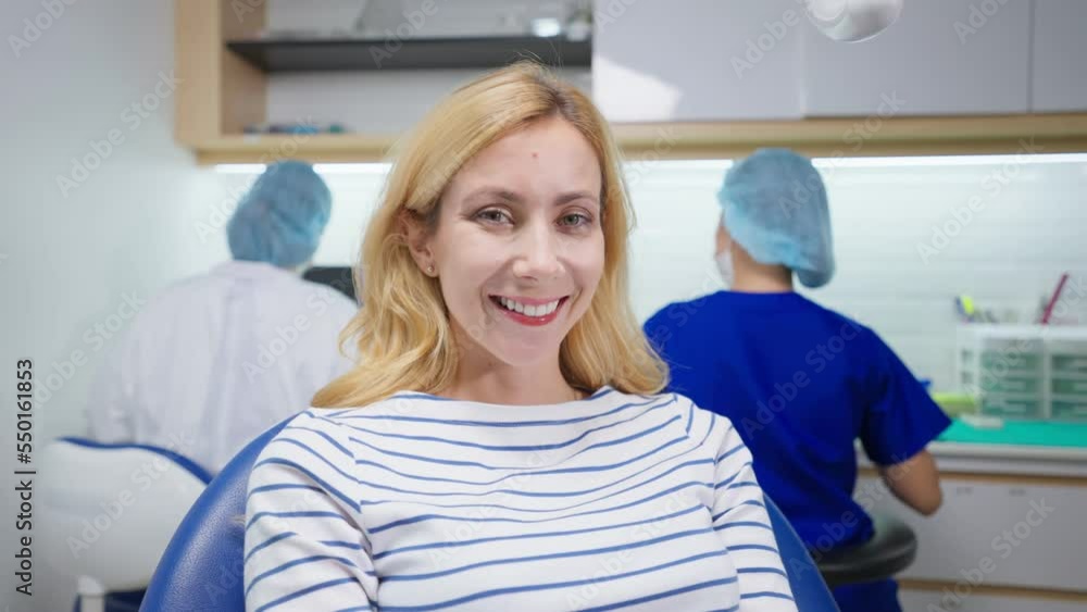Portrait of Caucasian woman patient and dentist at health care clinic. Portrait of Caucasian woman patient and dentist at health care clinic.