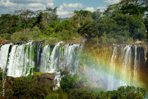 Panoramic of the Iguazú Falls with rainbow