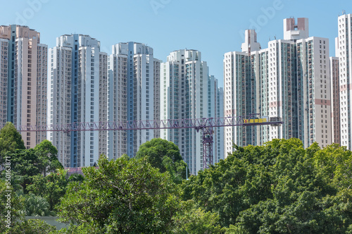 High rise residential building of public estate and crane in construction site in Hong Kong city