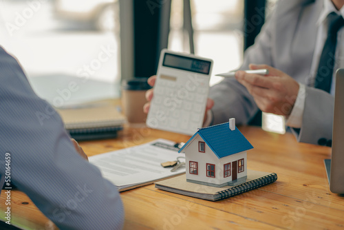 The concept of buying a house  the agent offers interest rate contracts on mortgages and home purchases for customers to sign contracts with real estate agents.