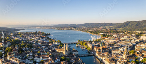 Aerial drone shot flying above Lake Zurich, Switzerland in sunny day.