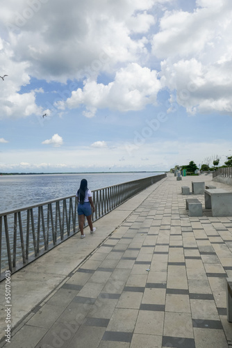 woman walking along the promenade in Barranquilla