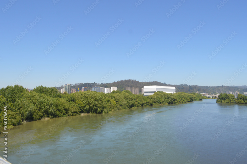 
the city of concepcion and the biobio river in chile in the summer season with blue sky