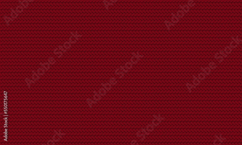 Texture of red knitted fabric. Cozy red knitting pattern