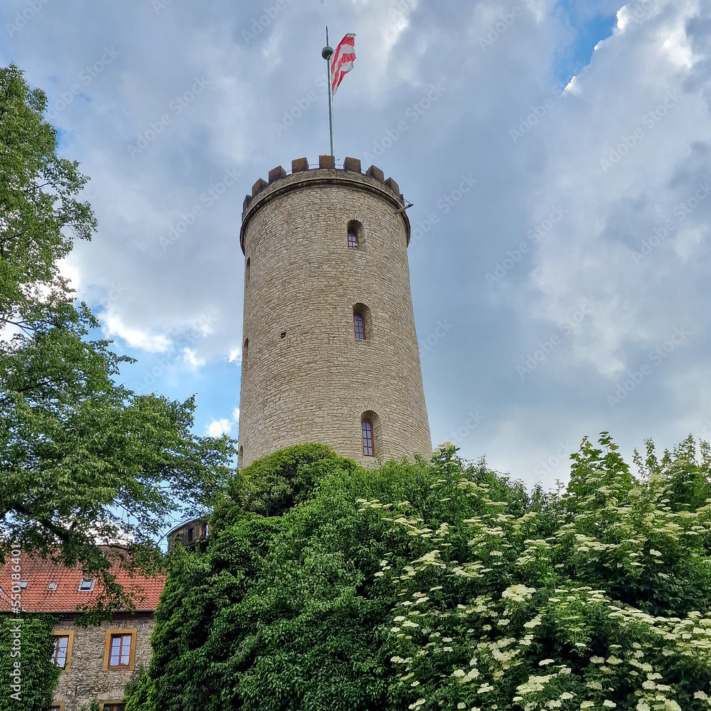 Sparrenburg Bielefeld with tower and walls under a nice cloudy blue sky