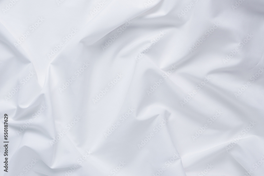 White fabric. luxurious white fabric texture background. Creases of satin, silk, and cotton.