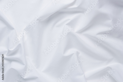 White fabric. luxurious white fabric texture background. Creases of satin, silk, and cotton.