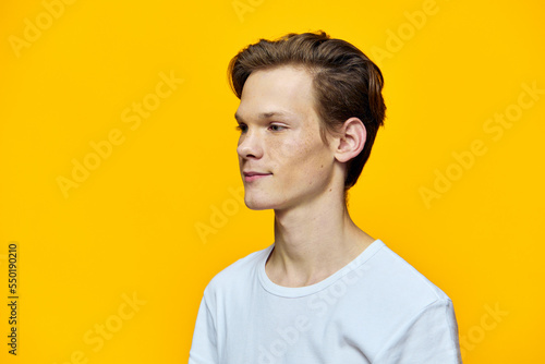 portrait of a funny guy on a yellow background