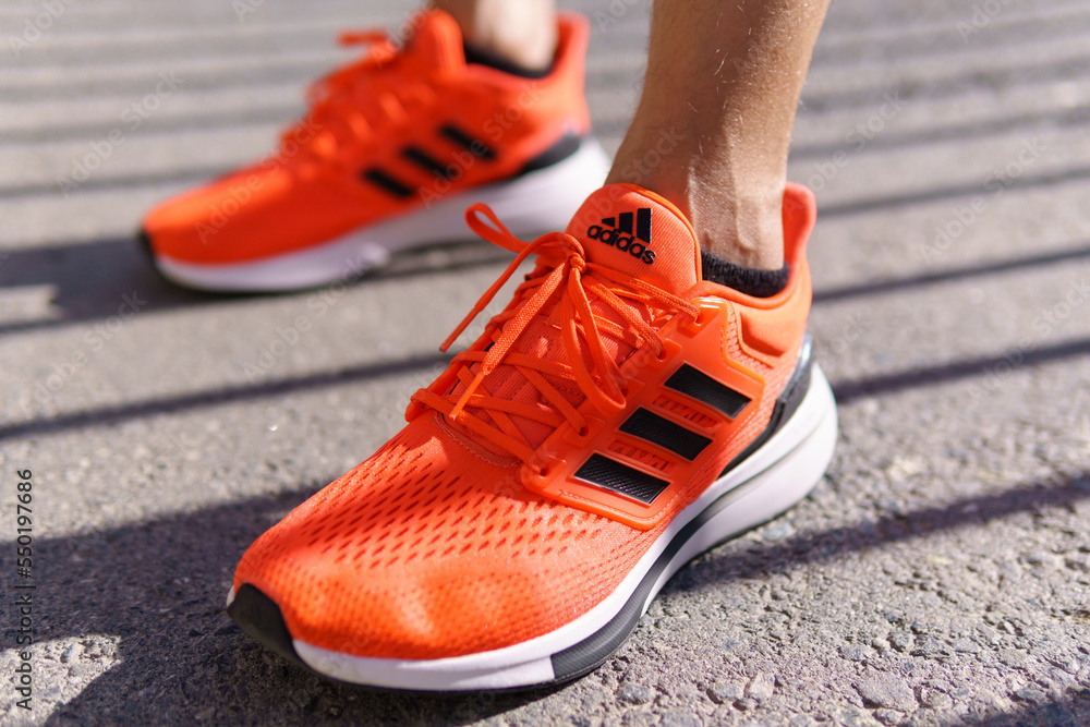 Tyumen Russia June 15 2022 Running orange sneakers adidas