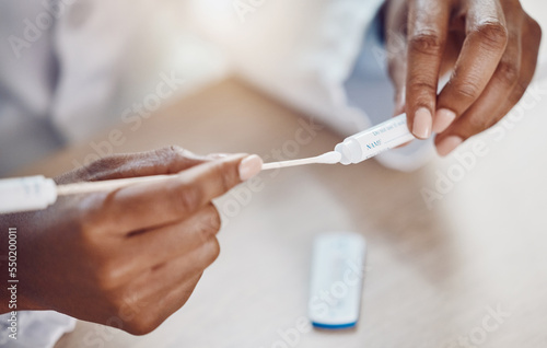 Healthcare, compliance and covid test by woman using rapid results testing kit at home. Closeup of hands holding a swab, corona and virus risk by female taking care and safety steps alone in house