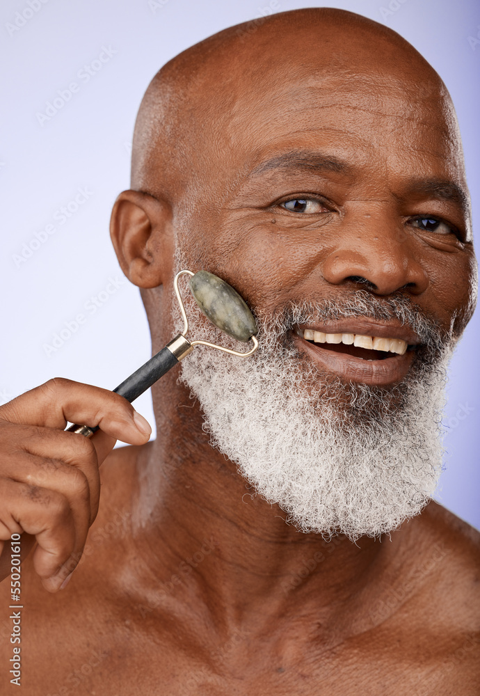 Skincare, face roller and senior black man in studio on purple background  for wellness, beauty and grooming. Dermatology, cosmetics and elderly male  with jade roller for facial massage and treatment Photos