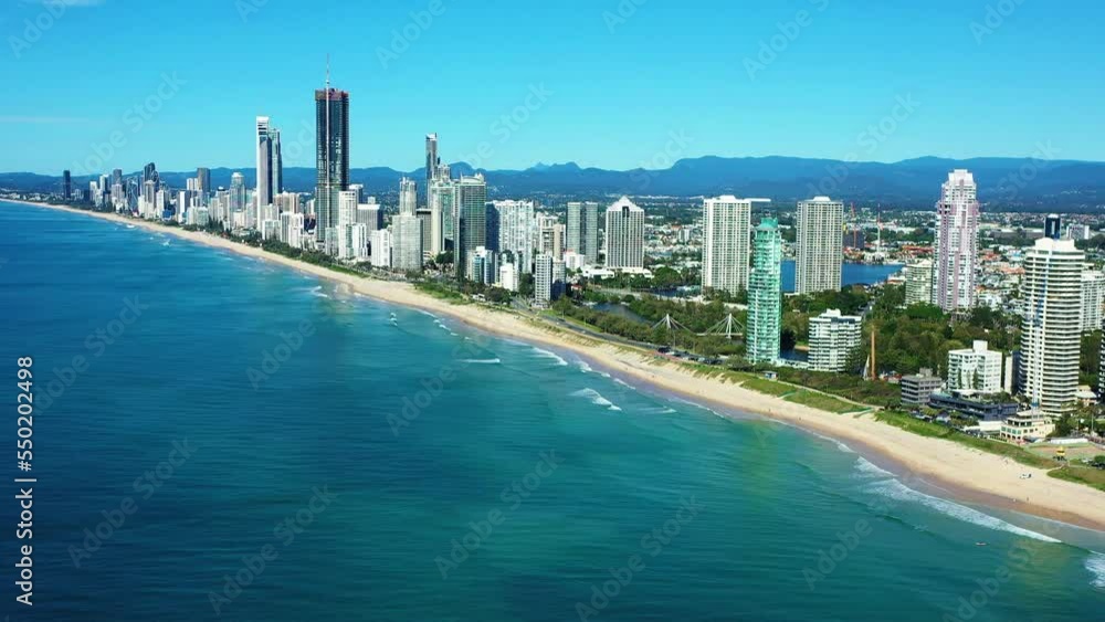 Iconic aerial view of the Magnificent Gold Coast, Surfers Paradise beachs, rolling waves on golden sands Iconic aerial view of the Magnificent Gold Coast, Surfers Paradise beachs, rolling waves on golden sands