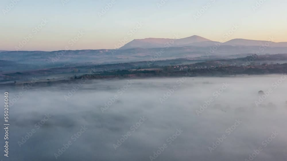 Beatiful aerial view on foggy small countryside. Beatiful aerial view on foggy small countryside.