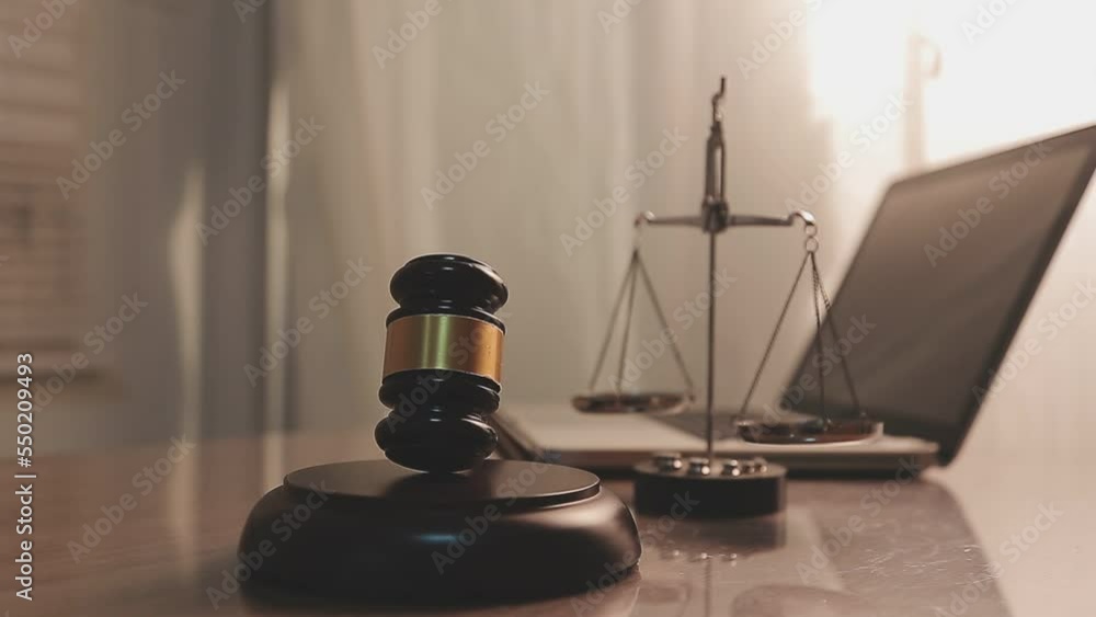 justice and law concept.Male judge in a courtroom on wooden table and Counselor or Male lawyer working in office. Legal law, advice and justice concept. justice and law concept.Male judge in a courtroom on wooden table and Counselor or Male lawyer working in office. Legal law, advice and justice concept.