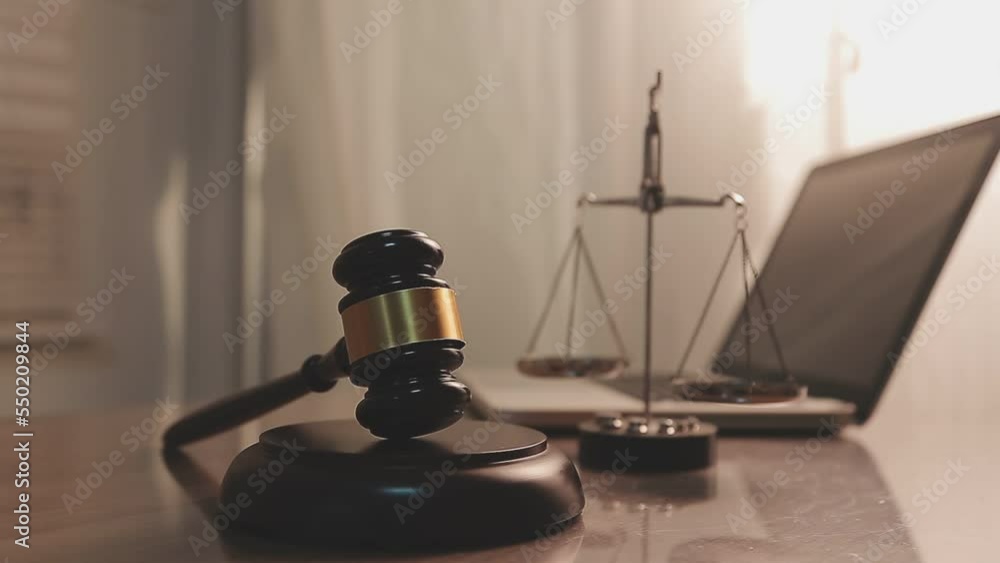 justice and law concept.Male judge in a courtroom on wooden table and Counselor or Male lawyer working in office. Legal law, advice and justice concept. justice and law concept.Male judge in a courtroom on wooden table and Counselor or Male lawyer working in office. Legal law, advice and justice concept.