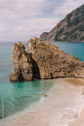 Tourist Swimming at the Beach in Monterosso Al Mare Cinque Terre Italy